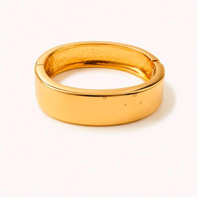 BRACELETE RIGIDO DOURADO COM DESIGN MODERNO