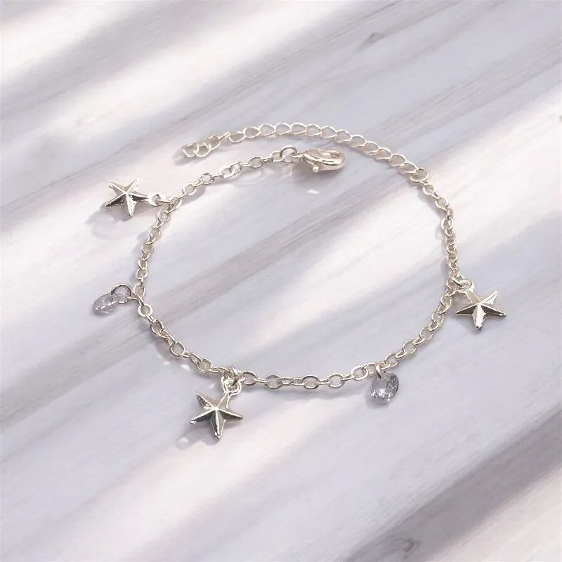 PULSEIRA ELO PORTUGUES COM PINGENTE ESTRELA/PONTO DE LUZ CRISTAL