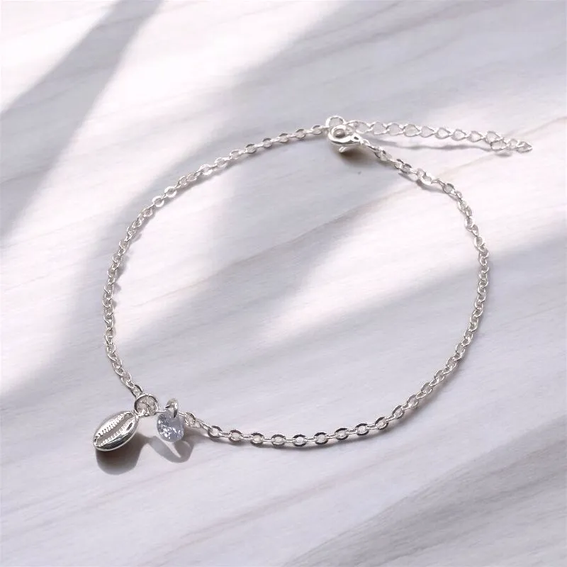PULSEIRA ELO PORTUGUES COM PINGENTE PONTO DE LUZ CRISTAL/BUZIOS