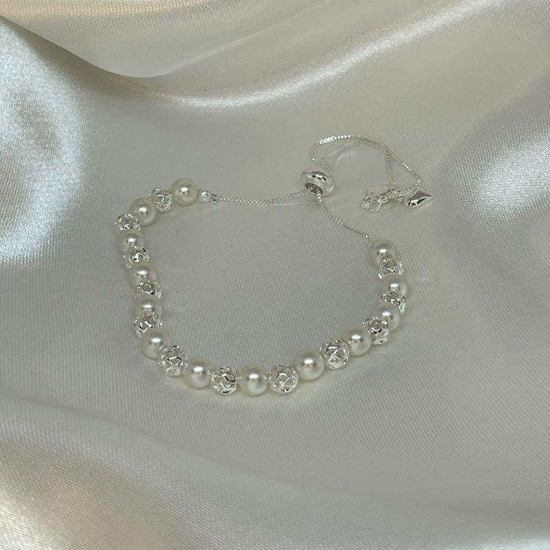 PULSEIRA GRAVATINHA COM PEROLAS E ESFERAS VAZADAS