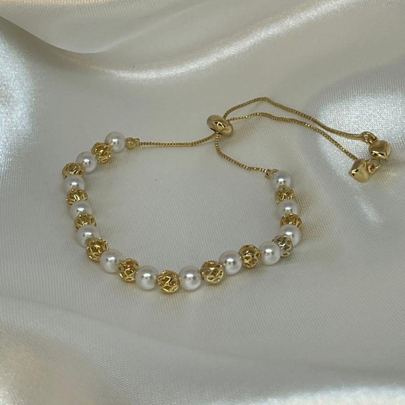 PULSEIRA GRAVATINHA COM PEROLAS E ESFERAS VAZADAS